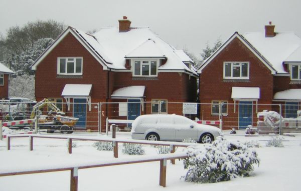 hHouses complete covered with snow