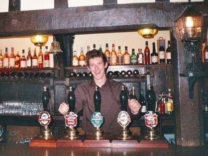 A smiling bar man  - on reopening night