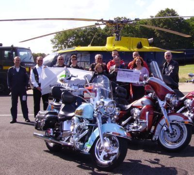 Harley Davidson motor bikes big cheque , helecopter