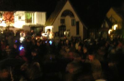 Crowds at bottom of Green      Darkness people lights from Spar Store        