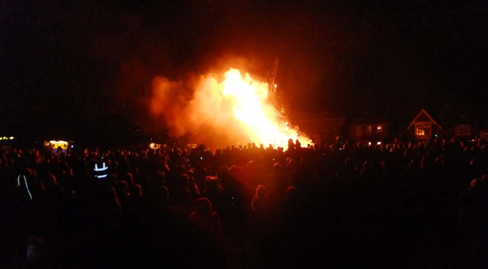 Crowd watching bonfire