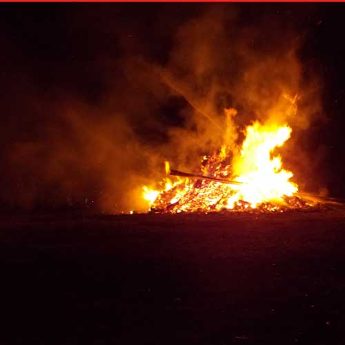 Bonfire burning tripod collapsed