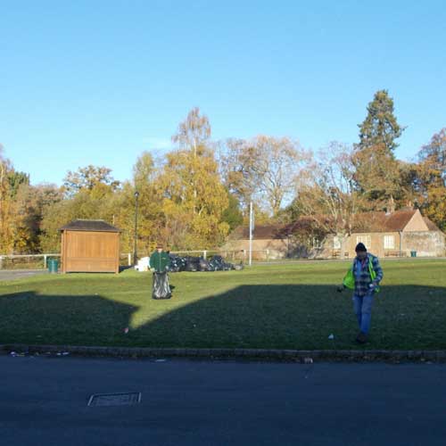 Rubish being collected on village green