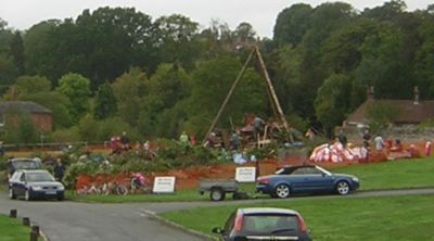 bonfire  with builders and cars