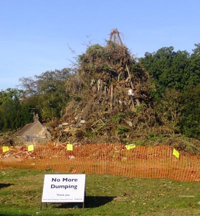 bonfire nearly complete with no dumping sign