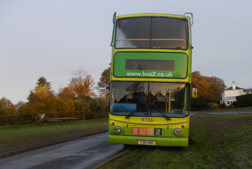 Buss on edge of road