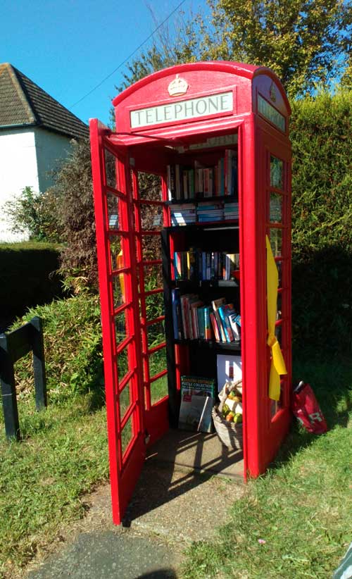 Phone Box door open showing books inside