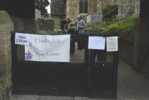 Church gate with notice for flute group