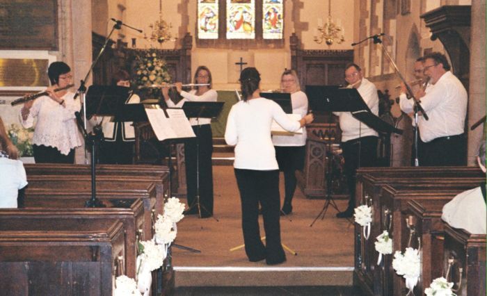 flute players concert in church