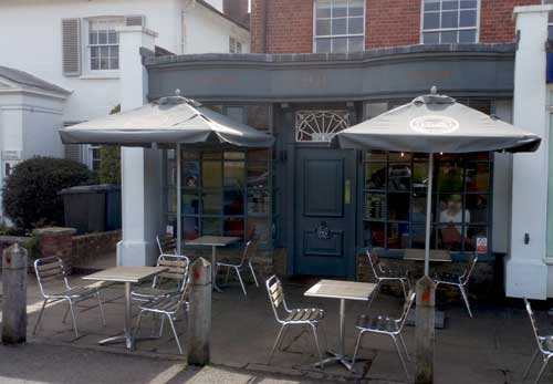 Tables and chairs outside coffee shop