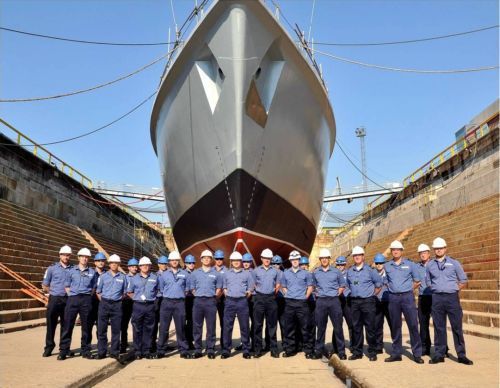 HMS Chiddingfold’s ship’s company at the dock bottom prior to flood-up.