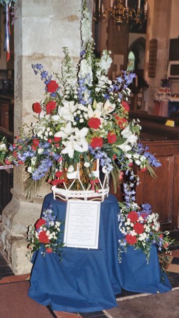 Flowers in church - by stone colum