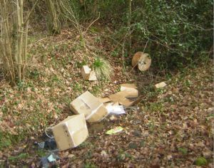 cardboard boxes , cabel drum in ditch