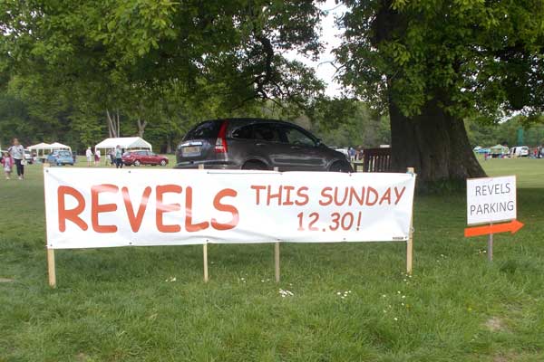 Large Revels  poster by oak tree at fete site