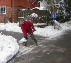 person shoveling snow