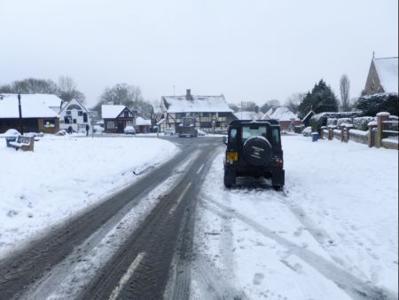 Snow scene  Bottom of village green looking towards The Crown Inn