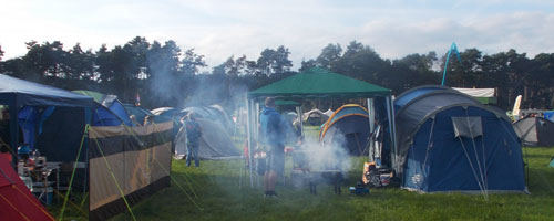 Tents and smoking fire