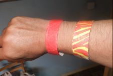 arm with wrist band for entry and one for camping